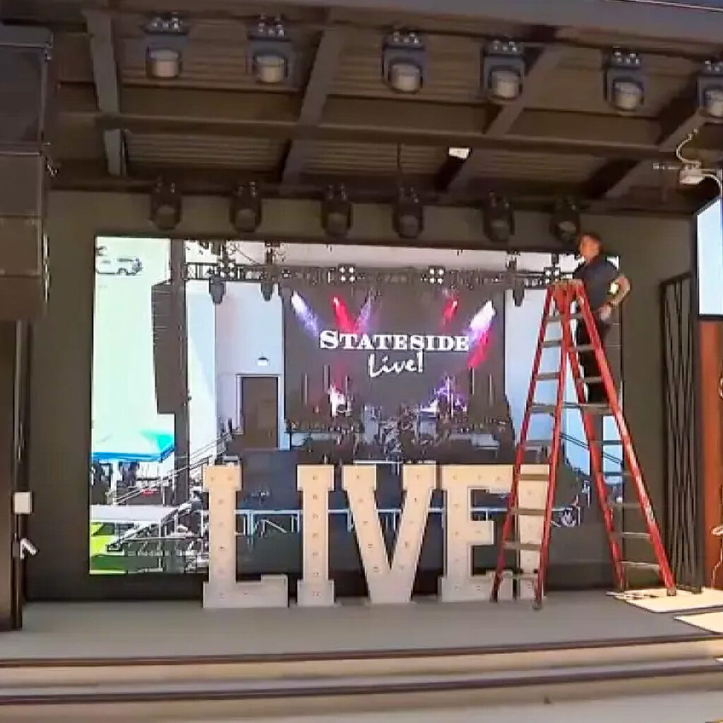 View of the Stateside Live outdoor performance stage from a seating area above the venue